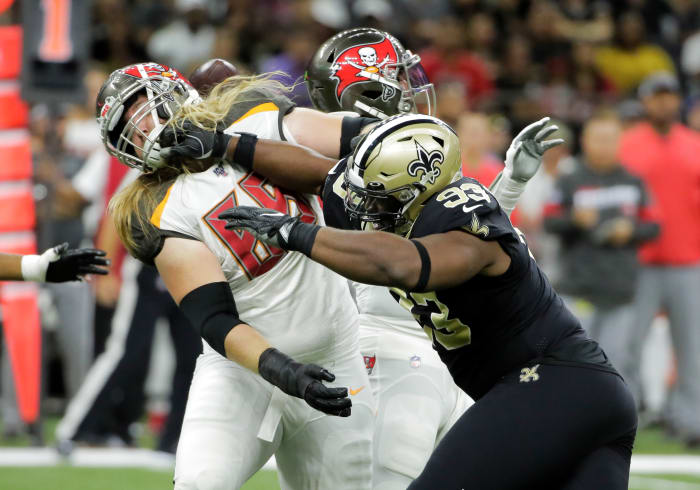 Oct 6, 2019; New Orleans, LA, USA; New Orleans Saints defensive tackle David Onyemata (93) rushes against Tampa Bay Buccaneers offensive guard Alex Cappa (65) during the first quarter at the Mercedes-Benz Superdome. Mandatory Credit: